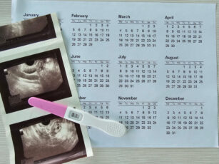 A Positive Pregnancy Test, Ultrasound Scan Pictures And A Calendar